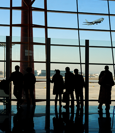 Walking through airport terminal on business travel