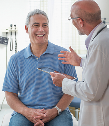 Doctor explains what options the patient has that align with his medical insurance