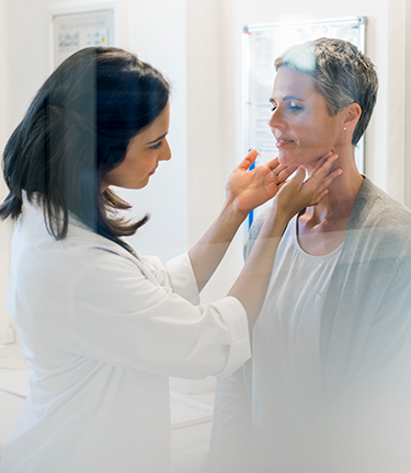 Doctor checking patients neck glands for signs of illness